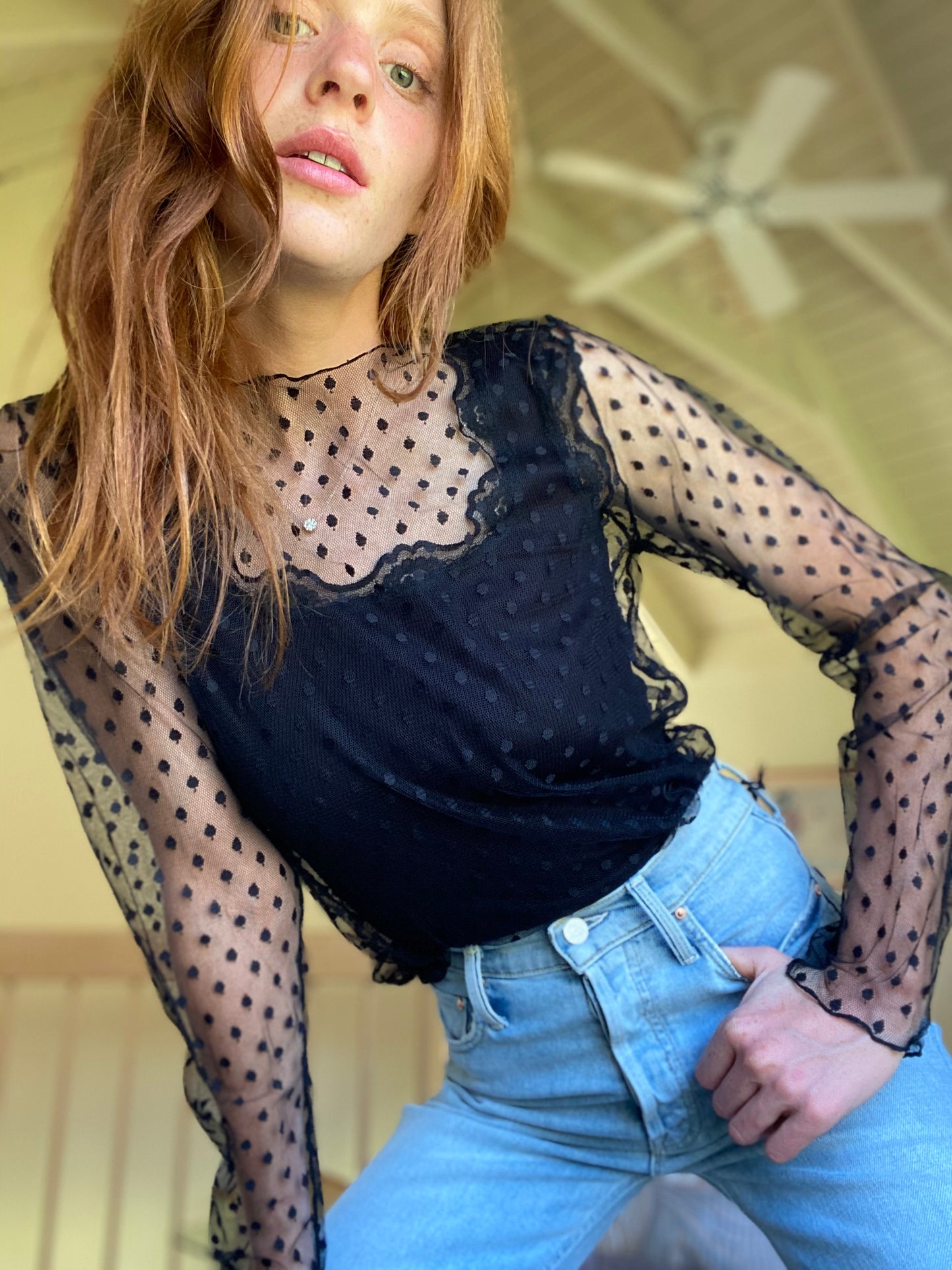 The "Clare" black sheer dot tulle top